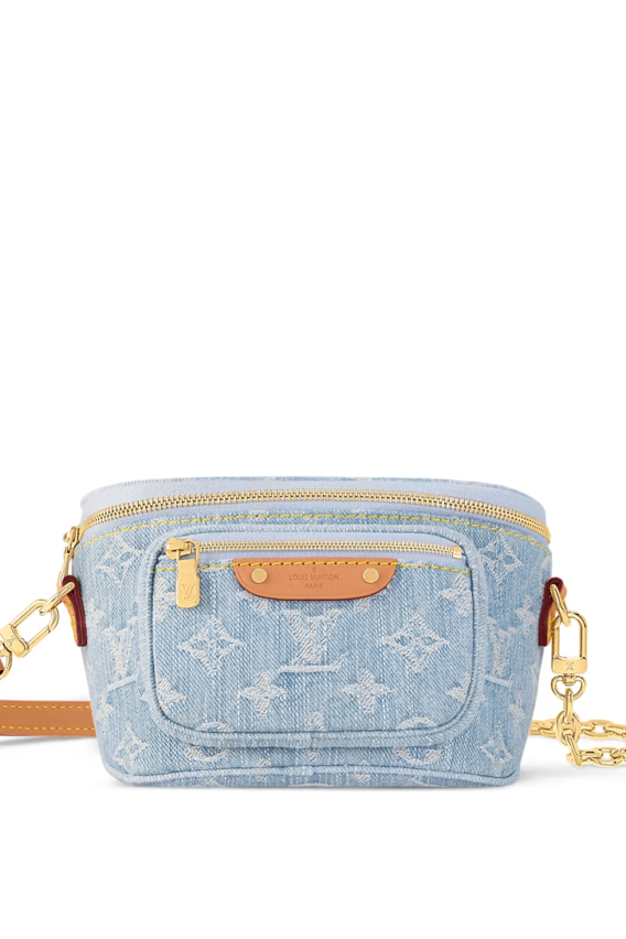 A summery Louis Vuitton Mini Bumbag in vintage-look sky blue Monogram denim, featuring a bleached and stonewashed finish, gold-tone hardware, a front pocket with an embossed leather label, and versatile removable chain and adjustable strap options.