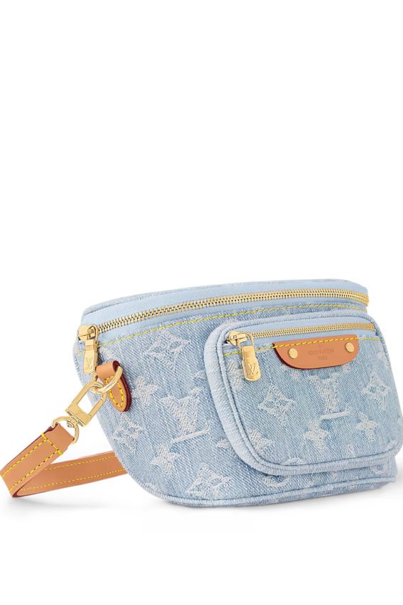 A summery Louis Vuitton Mini Bumbag in vintage-look sky blue Monogram denim, featuring a bleached and stonewashed finish, gold-tone hardware, a front pocket with an embossed leather label, and versatile removable chain and adjustable strap options.