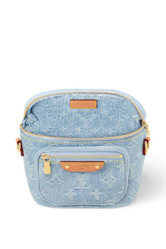 A summery Louis Vuitton Mini Bumbag in vintage-look sky blue Monogram denim, featuring a bleached and stonewashed finish, gold-tone hardware, a front pocket with an embossed leather label, and versatile removable chain and adjustable strap options.